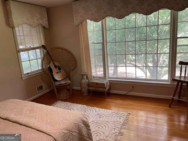 1470 Dunn Rd, Cumming, GA 30040 - bedroom featuring baseboards and wood finished floors