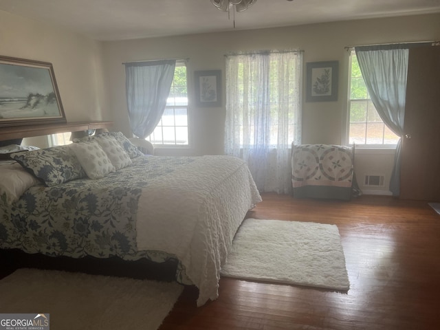1470 Dunn Rd, Cumming, GA 30040 - bedroom with multiple windows and wood finished floors