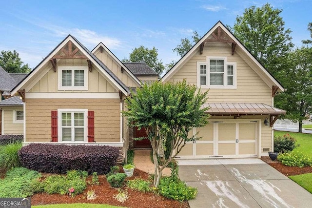104 Beacon Crst, Newnan, GA 30265 - view of front of home featuring board and batten siding, an attached garage, a standing seam roof, driveway, and metal roof