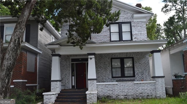 616 W 40th St, Savannah, GA 31415 - view of front of home featuring brick siding and a porch