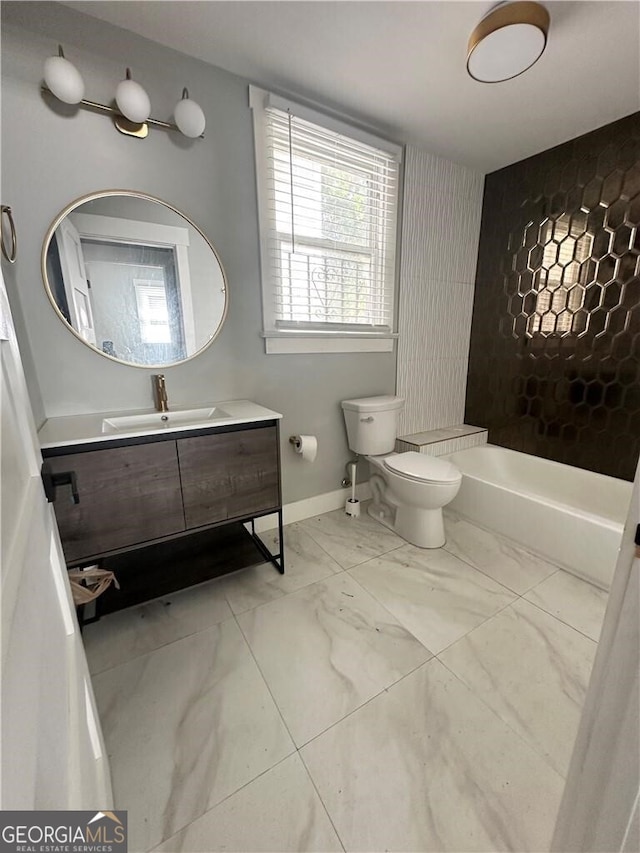 616 W 40th St, Savannah, GA 31415 - full bath with a tub to relax in, vanity, and marble finish flooring