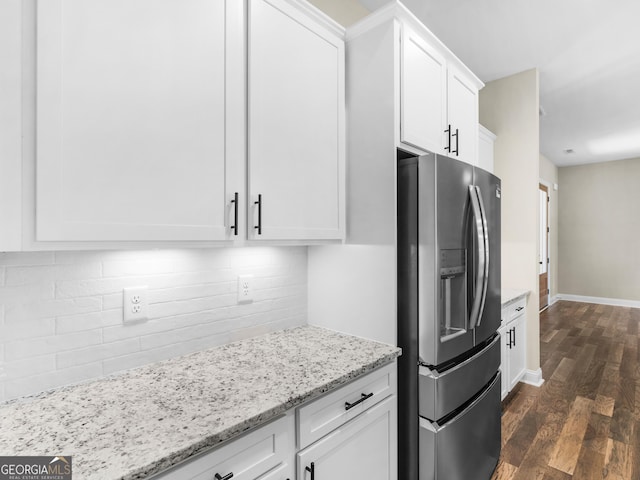 1847 Davis Mill Rd N, Dallas, GA 30157 - kitchen featuring stainless steel fridge, dark wood finished floors, white cabinets, light stone counters, and decorative backsplash