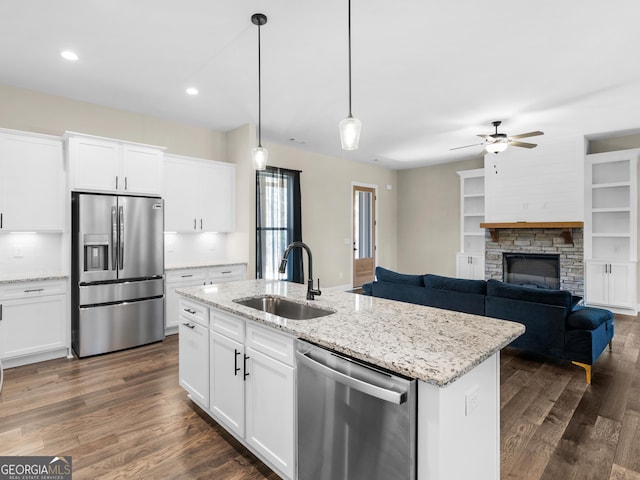 1847 Davis Mill Rd N, Dallas, GA 30157 - kitchen featuring appliances with stainless steel finishes, a sink, dark wood-style floors, a ceiling fan, and recessed lighting