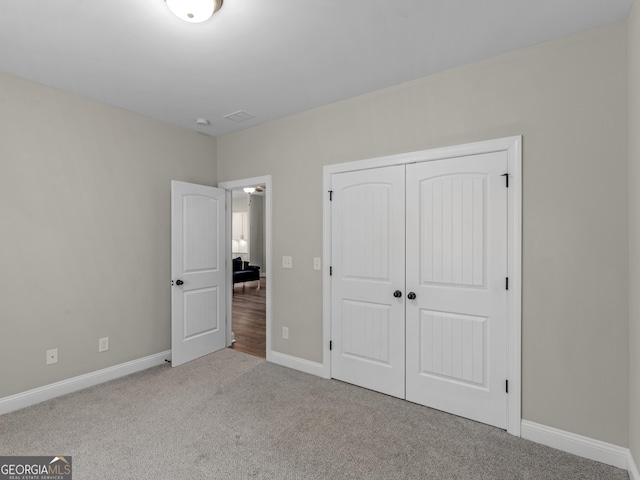 1847 Davis Mill Rd N, Dallas, GA 30157 - unfurnished bedroom featuring carpet floors, a closet, and baseboards