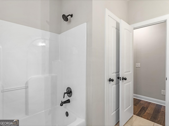 1847 Davis Mill Rd N, Dallas, GA 30157 - bathroom with shower / washtub combination, wood finished floors, and baseboards