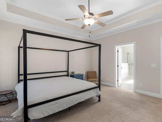 1847 Davis Mill Rd N, Dallas, GA 30157 - carpeted bedroom featuring a tray ceiling, ornamental molding, baseboards, a ceiling fan, and ensuite bath