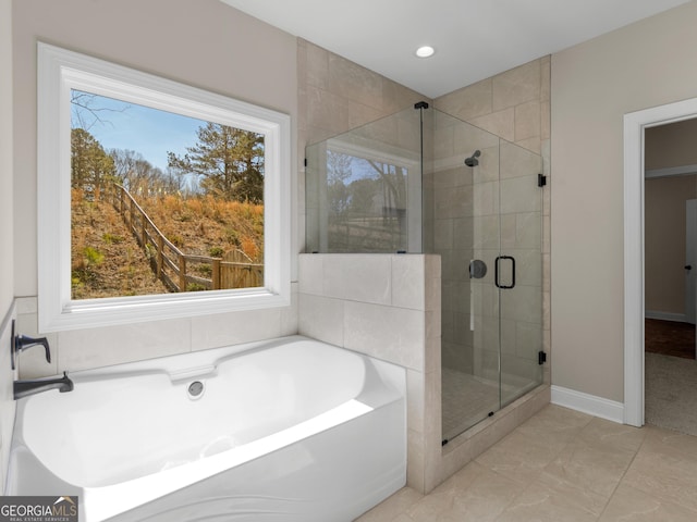 1847 Davis Mill Rd N, Dallas, GA 30157 - full bath with a bath, a stall shower, recessed lighting, and baseboards
