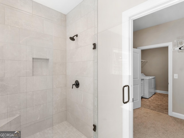 1847 Davis Mill Rd N, Dallas, GA 30157 - bathroom with washer and clothes dryer, a shower stall, and baseboards