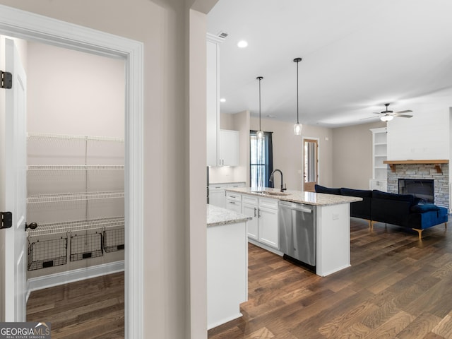 1847 Davis Mill Rd N, Dallas, GA 30157 - kitchen with stainless steel dishwasher, a sink, white cabinets, ceiling fan, and dark wood-style floors