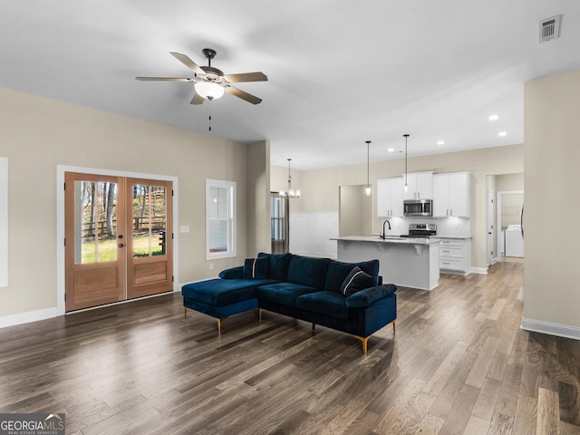 1847 Davis Mill Rd N, Dallas, GA 30157 - living area with wood finished floors, recessed lighting, ceiling fan, baseboards, and a chandelier