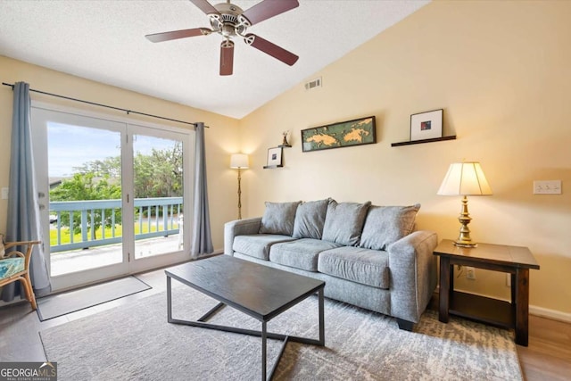 226 Bull River Bluff Dr, Savannah, GA 31410 - living area with vaulted ceiling, a ceiling fan, a textured ceiling, baseboards, and wood finished floors