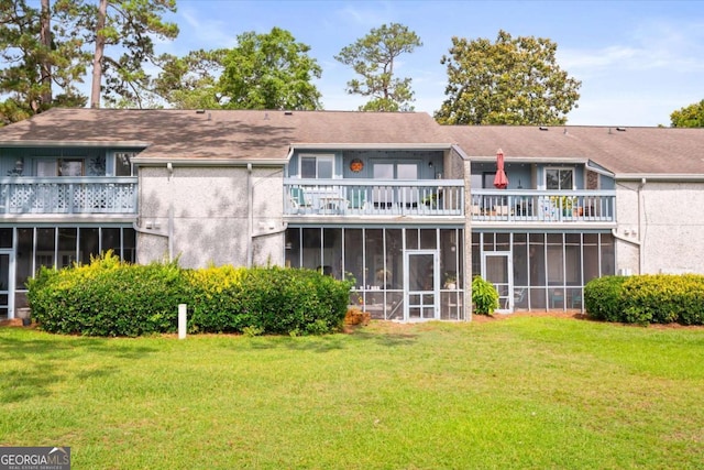 226 Bull River Bluff Dr, Savannah, GA 31410 - rear view of property with a sunroom, a balcony, a yard, and stucco siding