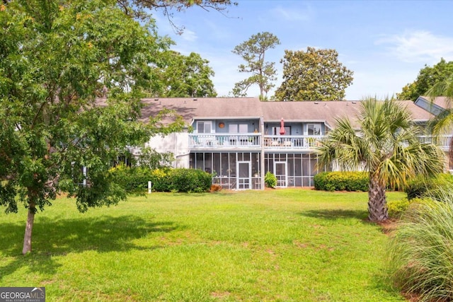 226 Bull River Bluff Dr, Savannah, GA 31410 - rear view of property with a sunroom, a balcony, and a lawn
