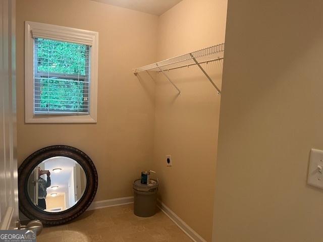 82 Sweetwater Way, Senoia, GA 30276 - laundry room featuring hookup for an electric dryer and baseboards