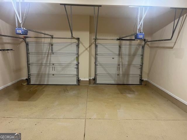 82 Sweetwater Way, Senoia, GA 30276 - garage featuring baseboards and a garage door opener
