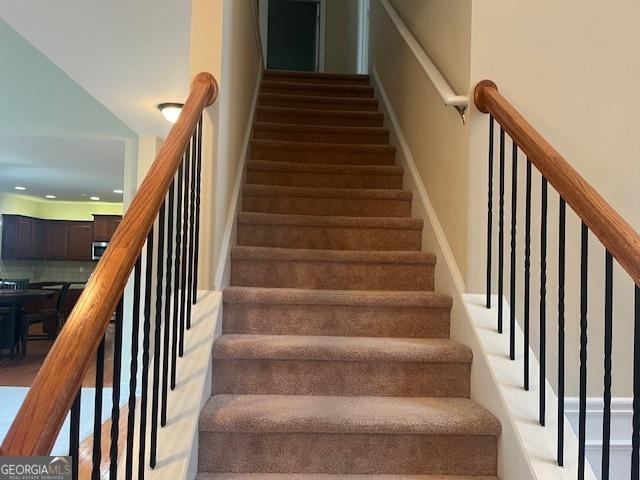 82 Sweetwater Way, Senoia, GA 30276 - staircase with recessed lighting and baseboards