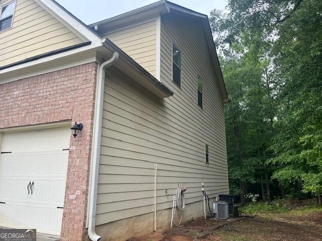 82 Sweetwater Way, Senoia, GA 30276 - view of side of home with brick siding