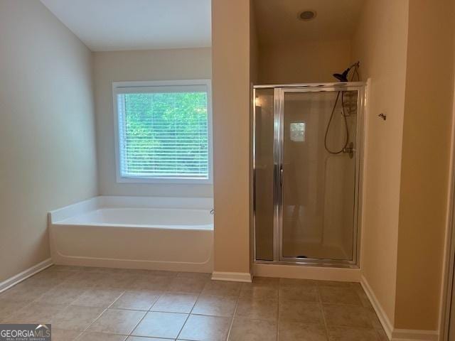 82 Sweetwater Way, Senoia, GA 30276 - full bath with a bath, a shower stall, tile patterned flooring, and baseboards