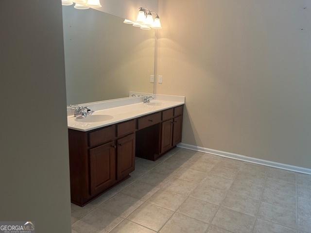 82 Sweetwater Way, Senoia, GA 30276 - full bathroom featuring double vanity and baseboards