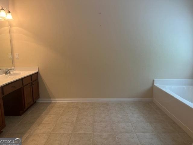 82 Sweetwater Way, Senoia, GA 30276 - full bath featuring vanity, a garden tub, and baseboards