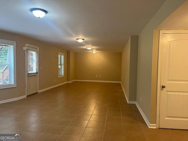 82 Sweetwater Way, Senoia, GA 30276 - spare room featuring tile patterned flooring and baseboards