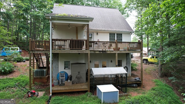509 White Pine Cir, Demorest, GA 30535 - back of property with a deck, stairs, a shingled roof, and central AC