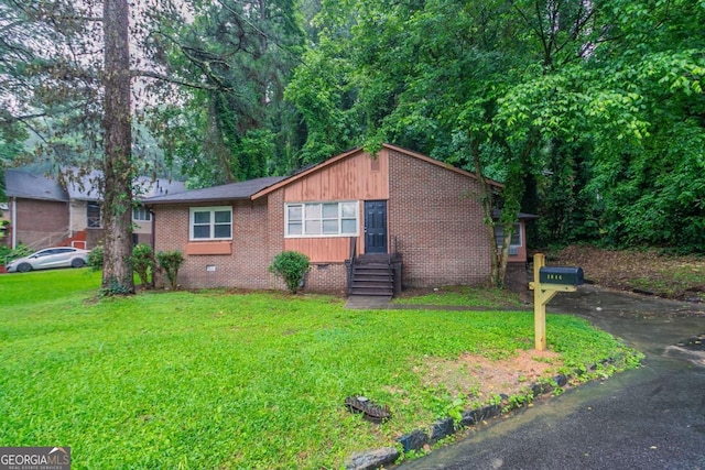 2046 Rector Dr SW, Atlanta, GA 30311 - view of front of house featuring crawl space, entry steps, a front lawn, and brick siding