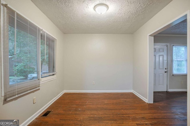 2046 Rector Dr SW, Atlanta, GA 30311 - spare room featuring wood finished floors and a textured ceiling