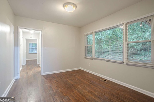 2046 Rector Dr SW, Atlanta, GA 30311 - empty room featuring dark wood-style floors and baseboards