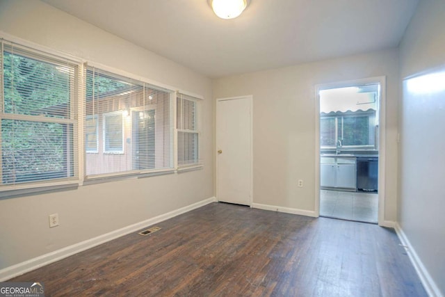 2046 Rector Dr SW, Atlanta, GA 30311 - spare room featuring dark wood finished floors and baseboards