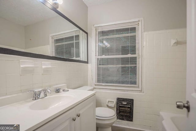 2046 Rector Dr SW, Atlanta, GA 30311 - full bath featuring tile walls, vanity, a textured ceiling, and shower / bathtub combination