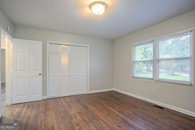 2046 Rector Dr SW, Atlanta, GA 30311 - unfurnished bedroom featuring dark wood-style flooring and a closet