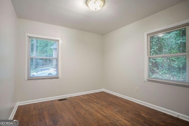 2046 Rector Dr SW, Atlanta, GA 30311 - empty room with wood finished floors and baseboards