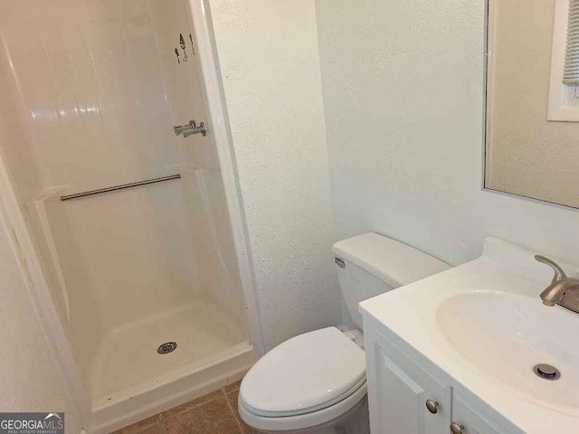 1261 Glenn Carrie Rd, Hull, GA 30646 - bathroom with toilet, vanity, tile patterned flooring, and a walk in shower