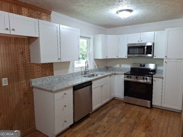 1261 Glenn Carrie Rd, Hull, GA 30646 - kitchen featuring stainless steel appliances, a sink, a textured ceiling, white cabinets, and crown molding