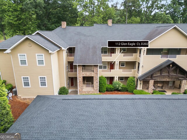112 Gleneagle Ct Unit D202, Clayton, GA 30525 - view of building exterior with view of scattered trees