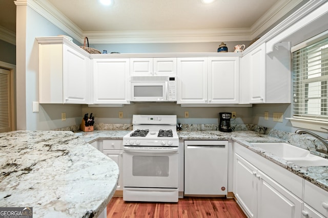 112 Gleneagle Ct Unit D202, Clayton, GA 30525 - kitchen featuring white appliances, ornamental molding, white cabinets, light wood finished floors, and light stone countertops