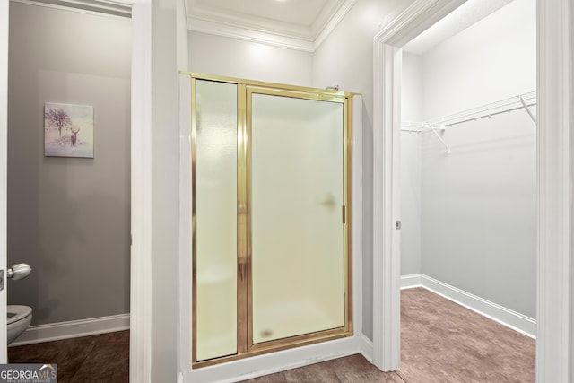 112 Gleneagle Ct Unit D202, Clayton, GA 30525 - full bathroom with crown molding, a shower stall, and a walk in closet