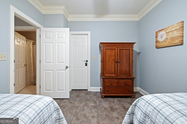 112 Gleneagle Ct Unit D202, Clayton, GA 30525 - bedroom featuring crown molding and dark carpet