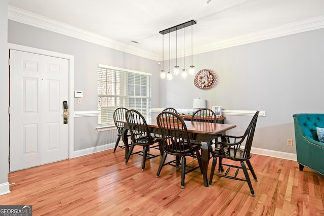 112 Gleneagle Ct Unit D202, Clayton, GA 30525 - dining area with light wood-type flooring and ornamental molding