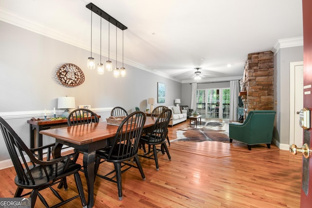 112 Gleneagle Ct Unit D202, Clayton, GA 30525 - dining room with ornamental molding, light wood-type flooring, and a ceiling fan