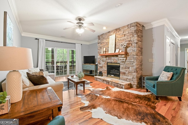 112 Gleneagle Ct Unit D202, Clayton, GA 30525 - living room with ornamental molding, wood finished floors, a ceiling fan, and a fireplace