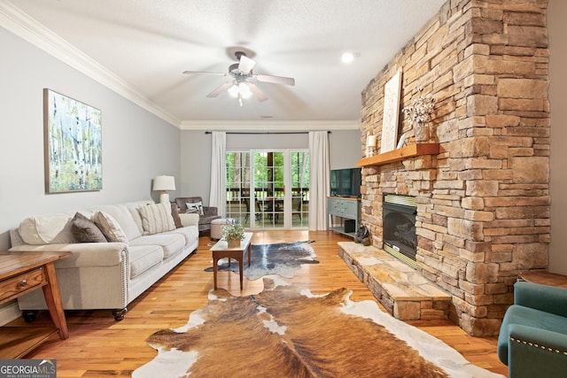 112 Gleneagle Ct Unit D202, Clayton, GA 30525 - living room with ceiling fan, light wood-style flooring, ornamental molding, and a fireplace