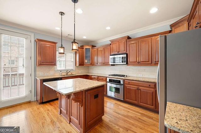 4503 Kendall Way, Roswell, GA 30075 - kitchen with appliances with stainless steel finishes, brown cabinetry, tasteful backsplash, ornamental molding, and recessed lighting