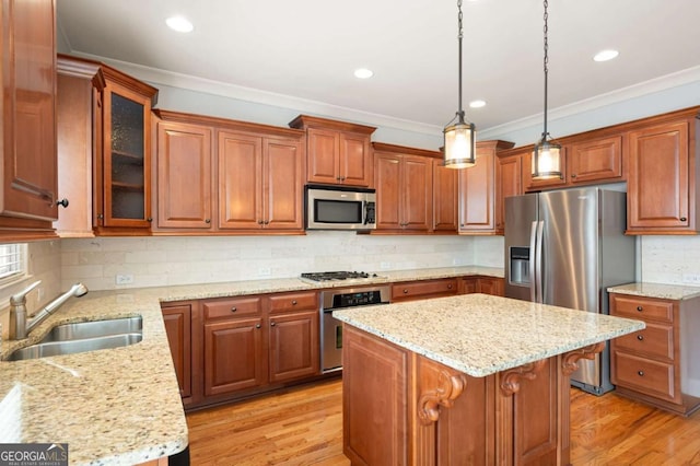 4503 Kendall Way, Roswell, GA 30075 - kitchen with appliances with stainless steel finishes, a sink, crown molding, brown cabinetry, and light stone counters