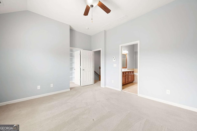 4503 Kendall Way, Roswell, GA 30075 - unfurnished bedroom featuring light carpet, baseboards, vaulted ceiling, connected bathroom, and a spacious closet