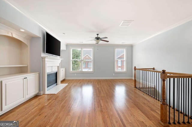 4503 Kendall Way, Roswell, GA 30075 - unfurnished living room featuring ceiling fan, crown molding, a fireplace with flush hearth, light wood finished floors, and baseboards