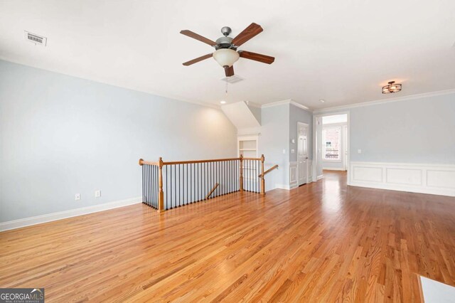 4503 Kendall Way, Roswell, GA 30075 - unfurnished living room with a ceiling fan, crown molding, and light wood-style floors