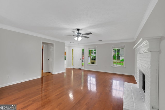 4009 Riverstone Dr, Suwanee, GA 30024 - unfurnished living room with a ceiling fan, a fireplace, baseboards, wood finished floors, and ornamental molding