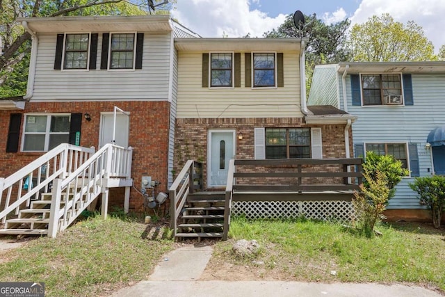 6991 Flagstone Dr, Austell, GA 30168 - view of front of home with brick siding and a wooden deck